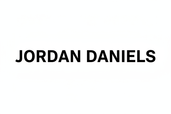 Akzidenz grotesk font with the name JORDAN DANIELS in all capital letters